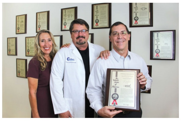 Inventors of the Apnea Guard Victoria Melzer, RDH, BS; Dr. Todd Morgan; and Dan Levendowski proudly displaying their patent.